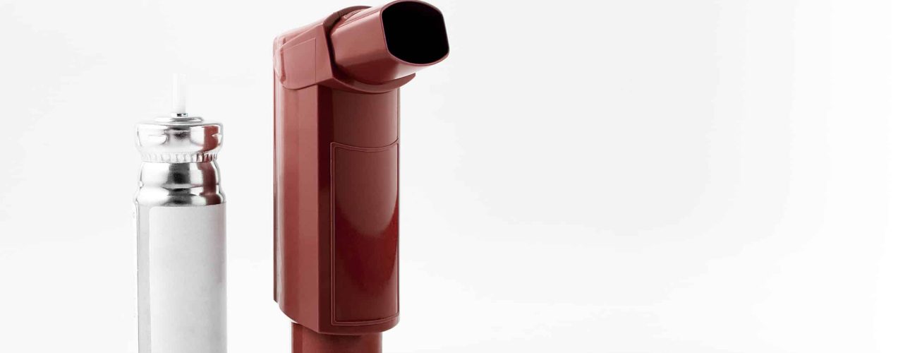 Brown MDI Inhaler. Asthma and Allergy aerosol for people with respiratory problems. White neutral background.