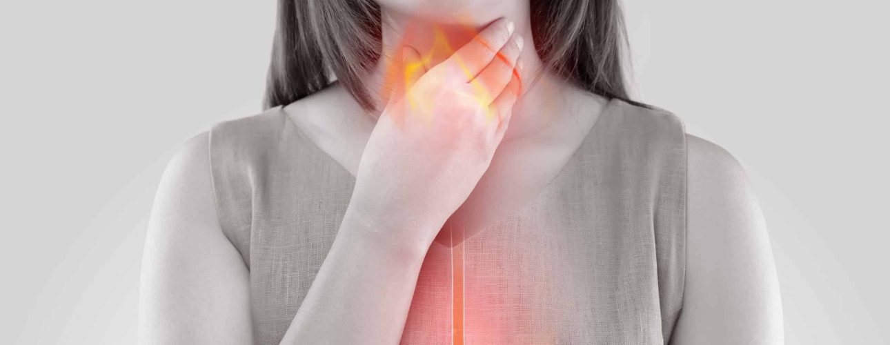 Woman Suffering From Acid Reflux Or Heartburn-Isolated On White Background