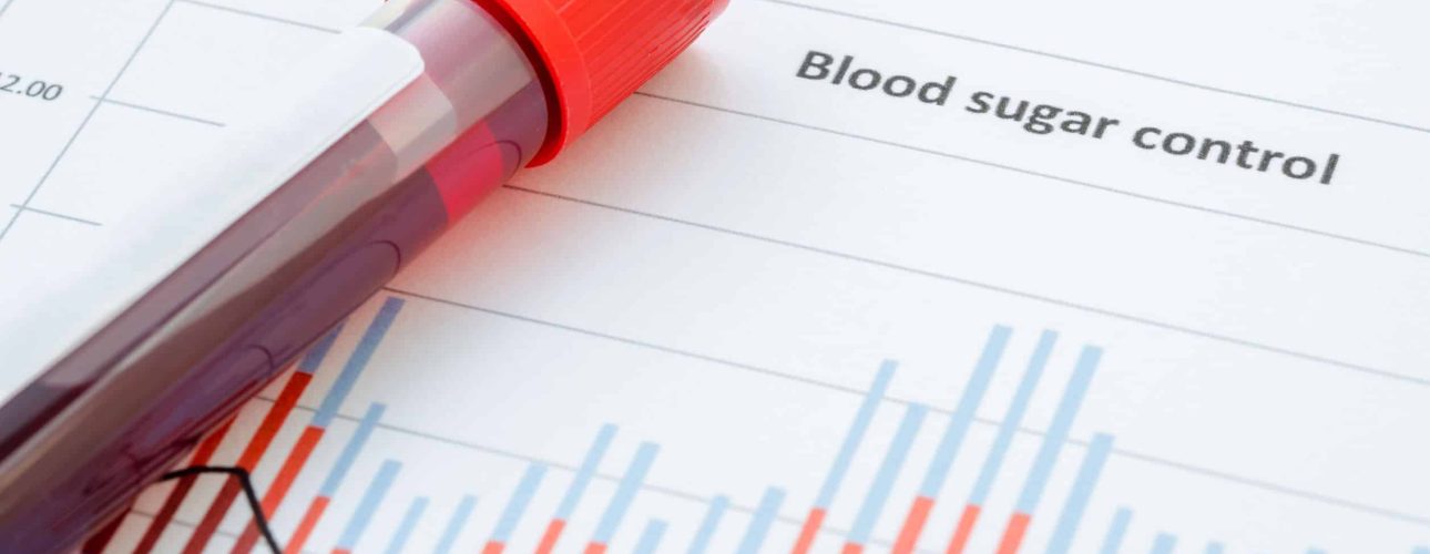 Sample blood for screening diabetic test in blood tube on blood sugar control chart.