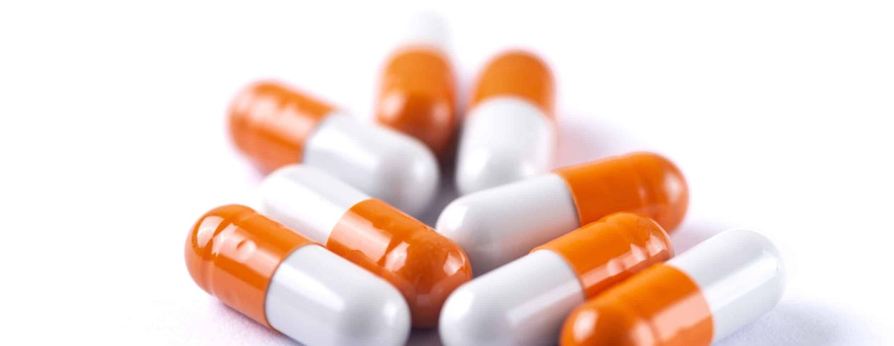 Drug prescription for treatment medication. Pharmaceutical medicament,  Pharmacy theme, Heap of orange white medicament