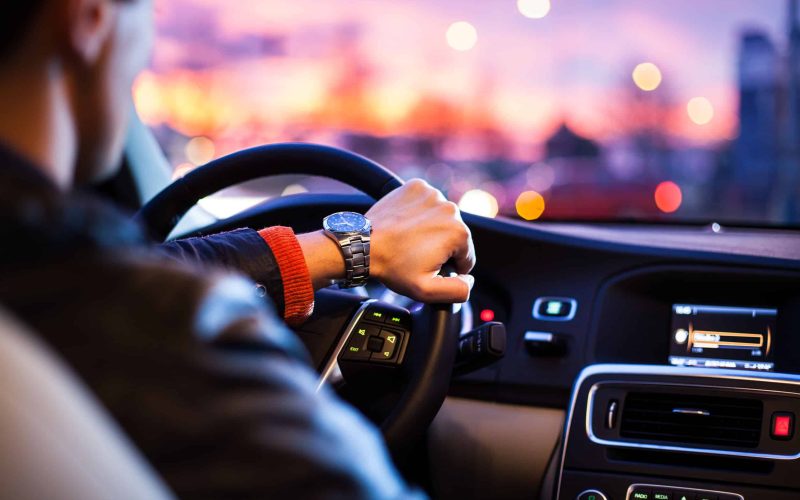 35027716 - driving a car at night -man driving his modern car at night in a city (shallow dof; color toned image)